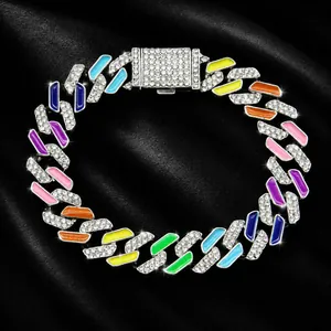 Close-up showing a vibrant enamel and rhinestone hip hop pet collar on black satin