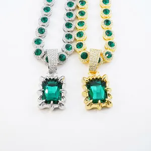 Detailed view of luxury vintage jewelry necklaces with emerald green gemstone pendants