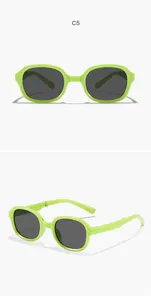 Detail of foldable children's sunglasses with stylish green square frame