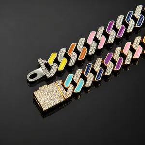 Detailed shot of a colorful iced-out Cuban link pet necklace with multi-color enamel.