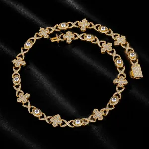Detailed view of luxury iced out hip hop necklace featuring gold evil eye and cross charms