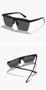 Macro view of black rimless children's sunglasses with dark integrated lenses