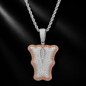 Detail of hip hop letter Y bone pendant featuring white and orange zircon micro-pave on rope chain