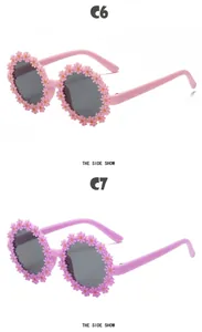 Profil de lunettes de soleil en forme de fleurs roses et violettes pour enfants avec marguerites