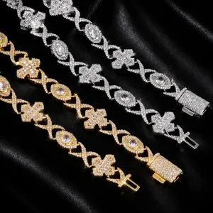 Macro view of iced-out hip-hop jewelry with cross and eye motifs in gold and silver