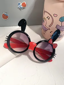 Detailed view of cute rabbit ear children's sunglasses with black frames and UV protection