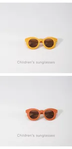 Detailansicht der runden Kinder-Sonnenbrille in den Farben Macaron-Gelb und Orange