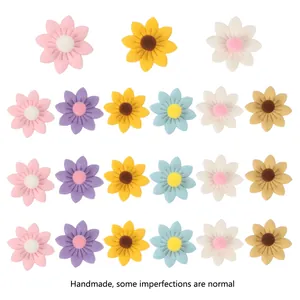 Detailed view of assorted handmade fabric sunflowers for DIY wedding and home decor