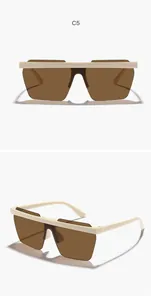 Detail view of brown lens children's shield sunglasses with cream frame