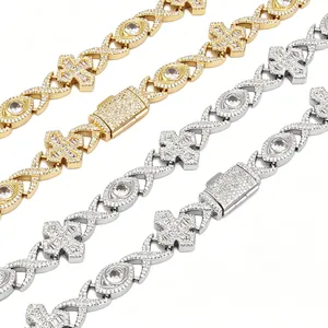 Close-up detail of hip hop iced out cross and evil eye necklaces with full zircon inlay