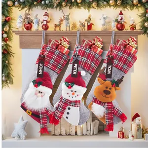 Set of three personalized Christmas stockings featuring Santa, Snowman, and Reindeer