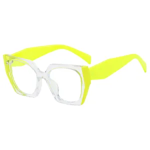Occhiali anti-luce blu oversize con montatura trasparente e aste giallo neon
