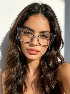Detailed view of stylish clear cat-eye fashion glasses worn by a model in sunlight