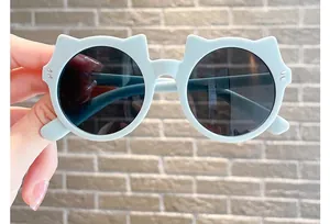 Close-up of cute cat-ear shaped children's sunglasses with light blue frames.