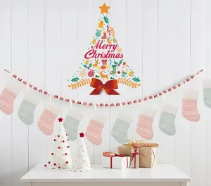 Festive scene with pink and blue knitted Christmas stockings hung on a decorative bead garland.