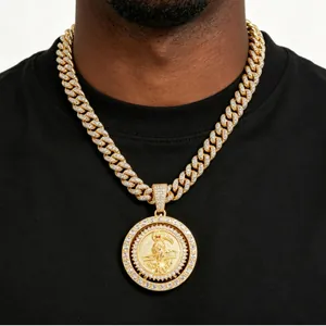 Detailed view of hip-hop gold Cuban chain with rotating pavé Grim Reaper pendant