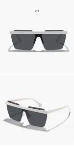 Detailed view of children's rimless polygonal one-piece sunglasses with white frame