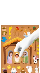 Hand applying Nativity scene stickers for children's Christmas DIY story activity