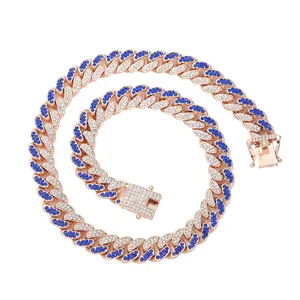 Detailed view of 13mm rose gold Cuban link necklace with blue and white rhinestones