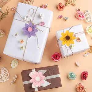 Felt sunflower and daisy flower ornaments used for decorating festive gift boxes and party favors