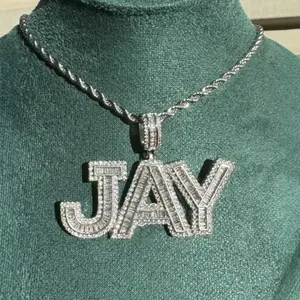 Detailed macro view of iced-out JAY letter pendant with glistening cubic zirconia