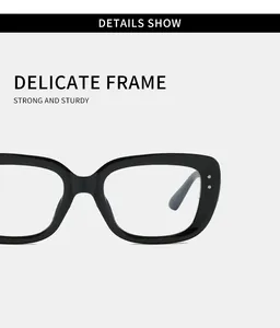Close-up of stylish black square glasses frame with elegant silver rivet details