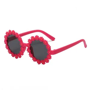 Lunettes de soleil mignonnes en forme de fleur rose avec verres de protection UV