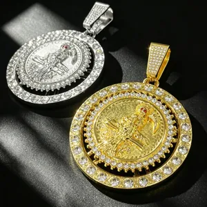 Close-up of gold and silver rotating hip-hop Grim Reaper pendants with rhinestones.