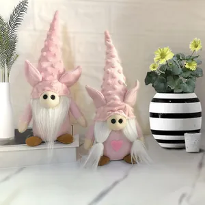 Detail showing two adorable pink Valentine gnomes with pig ears and soft plush texture.