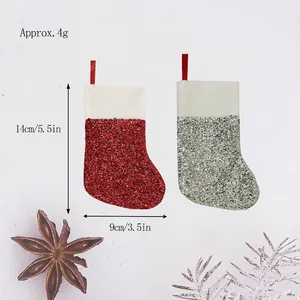 Miniature red and silver glittery Christmas stocking ornaments with dimensions 14cm by 9cm