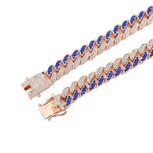 Detail view of 13mm iced out Cuban link necklace with sparkling blue and clear crystals