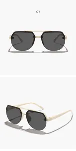 Detailed view of children's double bridge aviator sunglasses with beige frames