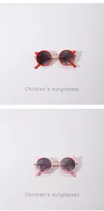Detailed view of children's cat-ear metal sunglasses in red and pink colors.