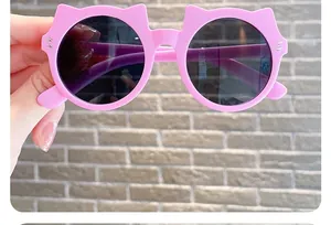 Cute pink cat-ear sunglasses for kids featuring round dark lenses for sun protection