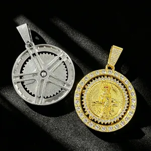 Close-up of gold and silver hip hop rotating Grim Reaper pendants with crystals