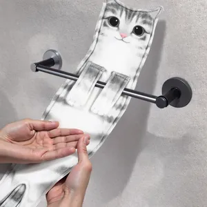 Adorable realistic cat-shaped hanging hand towel shown on a sleek metal bathroom rack