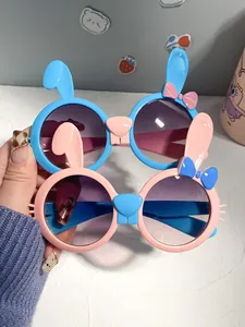 Macro view of cute cartoon rabbit sunglasses for kids in pink and blue pastel frames
