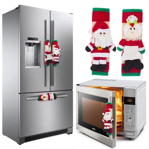 Housses de poignée de réfrigérateur de Noël Père Noël et Mère Noël sur les appareils.