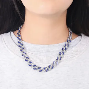 Detailed view of 12mm blue enamel and rhinestone Cuban link necklace on model's neck.