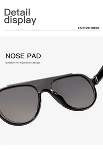 Detail of oversized black sunglasses focusing on the ergonomic integrated nose pad design.