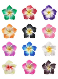Detailed view of vibrant 5-petal polymer clay plumeria flower beads for DIY projects