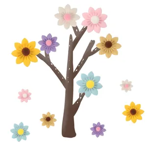 Detailed view of colorful felt sunflower decorations on a tree-shaped display stand.