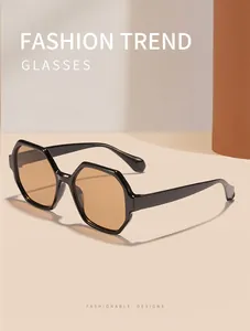Detailed macro view of retro polygonal sunglasses featuring fashionable amber tinted lenses