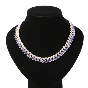 Detail of 13mm two-tone blue and white iced out Cuban link chain necklace jewelry