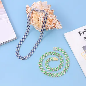 Detailed view of 12mm Cuban link necklaces with vibrant blue and green enamel accents