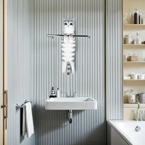 Detailed view of a cute realistic grey tabby cat-shaped hanging hand towel in a bathroom