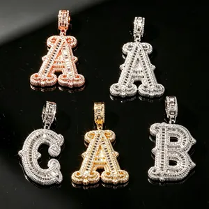 Close-up of iced-out alphabet pendants in gold, silver, and rose gold finishes