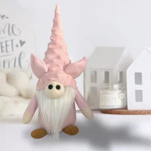 Close-up of a pink Valentine's gnome plush doll with pig ears and white beard ornament