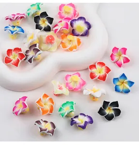 Detailed view of colorful plumeria polymer clay flower beads for DIY handmade crafts