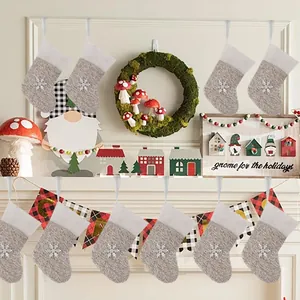 Set of ten mini gray and white knitted Christmas stockings with snowflake detail